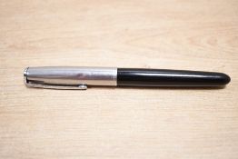 A Parker 51 Aerometric fill fountain pen in Black with lustraloy cap. Small dents to cap