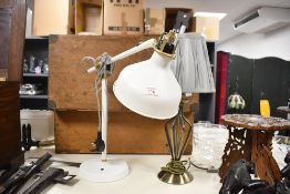 A modern vintage styled white painted angle poise desk lamp, with brass key adjuster and woven