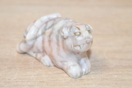 A small vintage Chinese hard stone recumbent Tiger figure, thought to be jade, featuring hand carved