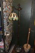 A tall late 20th-century Tiffany-style bridge arm floor lamp, featuring an Art Nouveau-style