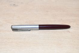 A Parker 51 Aerometric fill fountain pen in Burgundy with lustraloy cap. Some dents to cap