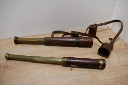 An early 20th-century Britannic B.C & Company brass and leather three-draw telescope with a