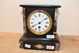 A Victorian black slate and marble mantel clock, of architectural style, having twin columns upon