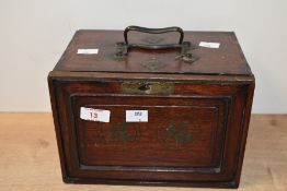 A late 19th to early 20th-century mahogany case Mahjong set, featuring hand carved and painted