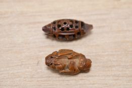 Two 19th/20th-century Chinese Hediao nut beads, featuring a finely carved boat and Immortal-style