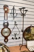 Two vintage wrought iron wall sconces, featuring minimalist arm detailing; sold with a tall