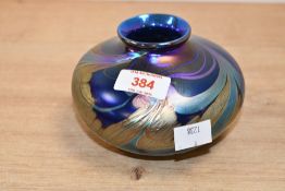 A 1993 Paul C. Brown studio art glass decorative vase, featuring an iridescent oil-slick lustre