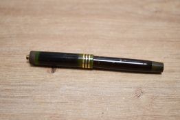 A Parker Duofold lucky Curve Lady button fill fountain pen in Jade Green (Discoloured) with three