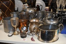 A quantity of late 19th to early 20th-century metalware, to feature a small leather cased travelling