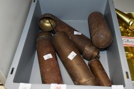 A group of four long case clock weights, three with brass surrounds