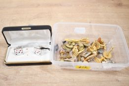 A collection of cufflinks and collar studs, including square and oval examples