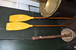 A pair of vintage Springwell Mouldings traditional boat paddles with yellow plastic blades, 121cm,