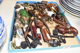 A large quantity of mainly continental wooden and porcelain tobacco smoking pipes, to include two