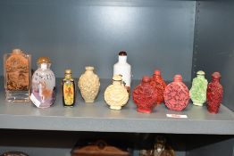 A collection of Chinese/eastern scent bottles, to include reverse painted rock crystal/glass
