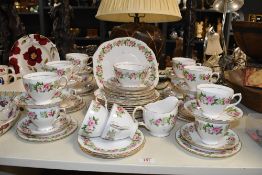 A Colglough bone china 'enchantment' pattern tea set, to include fourteen cups, sugar, cream and