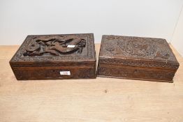 A mid to late 20th-century Chinese hand carved wooden box, featuring high relief carvings of dragons