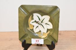 A small vintage Moorcroft pottery 'Bermuda Lily' ashtray, featuring tube-lined white lily decoration