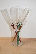 A vintage Artland glass baseless champagne flute set, featuring long hand blown colourful stems or