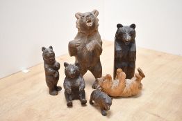A quantity of late 19th to 20th-century Black Forest hand carved bears, to feature a large example