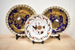 Two late 20th-century Royal Crown Derby 'Paradise Cobalt' English bone china plates, to feature
