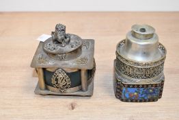 Two 20th-century Chinese white metal incense burners, comprising an example with a Foo dog finial,