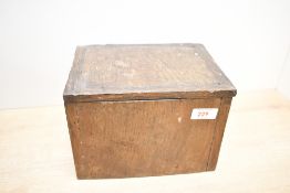 A 19th/20th century oak devotional box, of rectangular form and rustic construction, the hinged