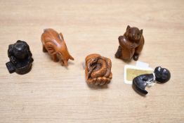 Four 20th-century boxwood Japanese Netsuke animal figures, to feature an elephant, a snake upon a