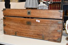 A large Victorian camphor wood campaign-style trunk, having brass corner mounts, twin handles and