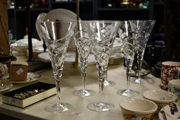 A group of six large modern crystal glass conical form wine/champagne glasses with swirled design,