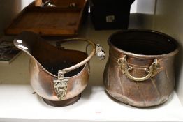 An eastern brass and copper coal bucket or planter, of cylindrical form with rolled rim, embossed
