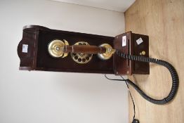 A vintage-style Steepletone 'Classic Museum Series' wooden wall telephone, with a brass-toned phone,
