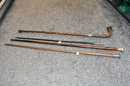 Four late 19th to early 20th-century Silver-mounted walking sticks, to feature silver marks for J.