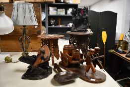 Two African carved hardwood figure groups, one carved as a group of Southern African women, kneeling