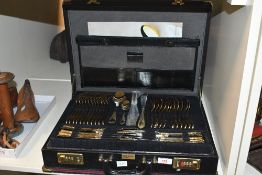 A canteen of Solingen Edelstahl Rostfrei gold-plated cutlery, contained in a lockable combination
