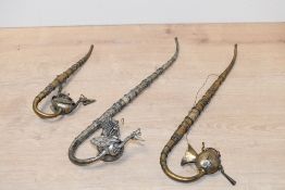 Three late 19th to early 20th-century Indian Opium pipes, featuring two peacock-shaped bowl examples