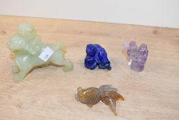 A quantity of 20th-century Chinese hardstone figures, to feature a carved green stone thought to