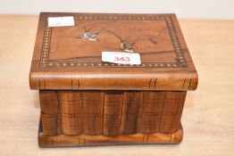 A vintage Italian Sorrento ware olive wood puzzle box, resembling a stack of books with hand painted