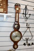A 19th Century mahogany cased onion barometer having silvered dial, with thermometer scale and