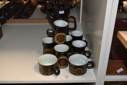A part Denby Arabesque pattern coffee set, comprising coffee pot, six tall cups, two traditional