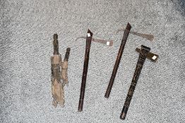 A near pair of ornamental African steel bladed throwing axes, with carved and copper inlaid