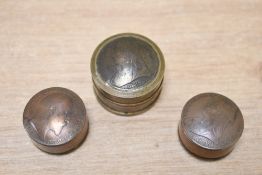 Three late Victorian coin-topped snuff boxes, two feature two smaller ones and a larger brass
