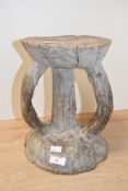 Of ethnographic interest, a small 20th-century African Art hand carved wood tribal stool, presumed