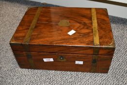A Victorian brass bound walnut writing slope, of traditional design and arrangement with leather
