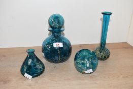 Four late 20th-century Mdina Glass 'Blue Crizzle' pieces, featuring a deep blue ground and sand-like