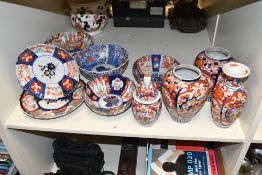 A selection of Japanese Imari porcelain, various including vases, bowls and plates, each decorated