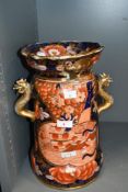 A 19th to early 20th-century Japanese Imari vase, featuring pastoral cartouches with floral and