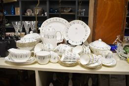 A quantity of Minton fine bone china Alpine Spring pattern dinner and tea wares, cups, saucers,