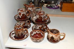 A vintage Fosters Studio Pottery coffee set, featuring a 'honeycomb' brown drip glaze, to include