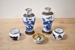 Two early 20th-century Imari-style porcelain pots having Silver rims, marked for London 1903; sold