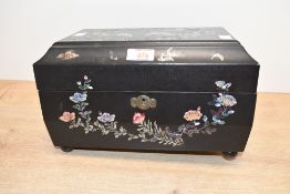 An early 20th-century Chinese black lacquer tea caddy, having inlaid abalone shell avian and foliate